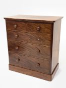 Victorian mahogany chest fitted with two short and three long graduated drawers, raised on plinth ba