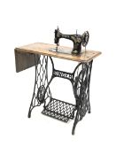 Early 20th century Singer treadle sewing machine with cast iron base