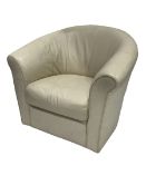 Contemporary tub shaped armchair, upholstered in cream leather, raised on swivel base