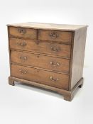 George III oak chest, moulded top over two short and three long graduated drawers, raised on shaped