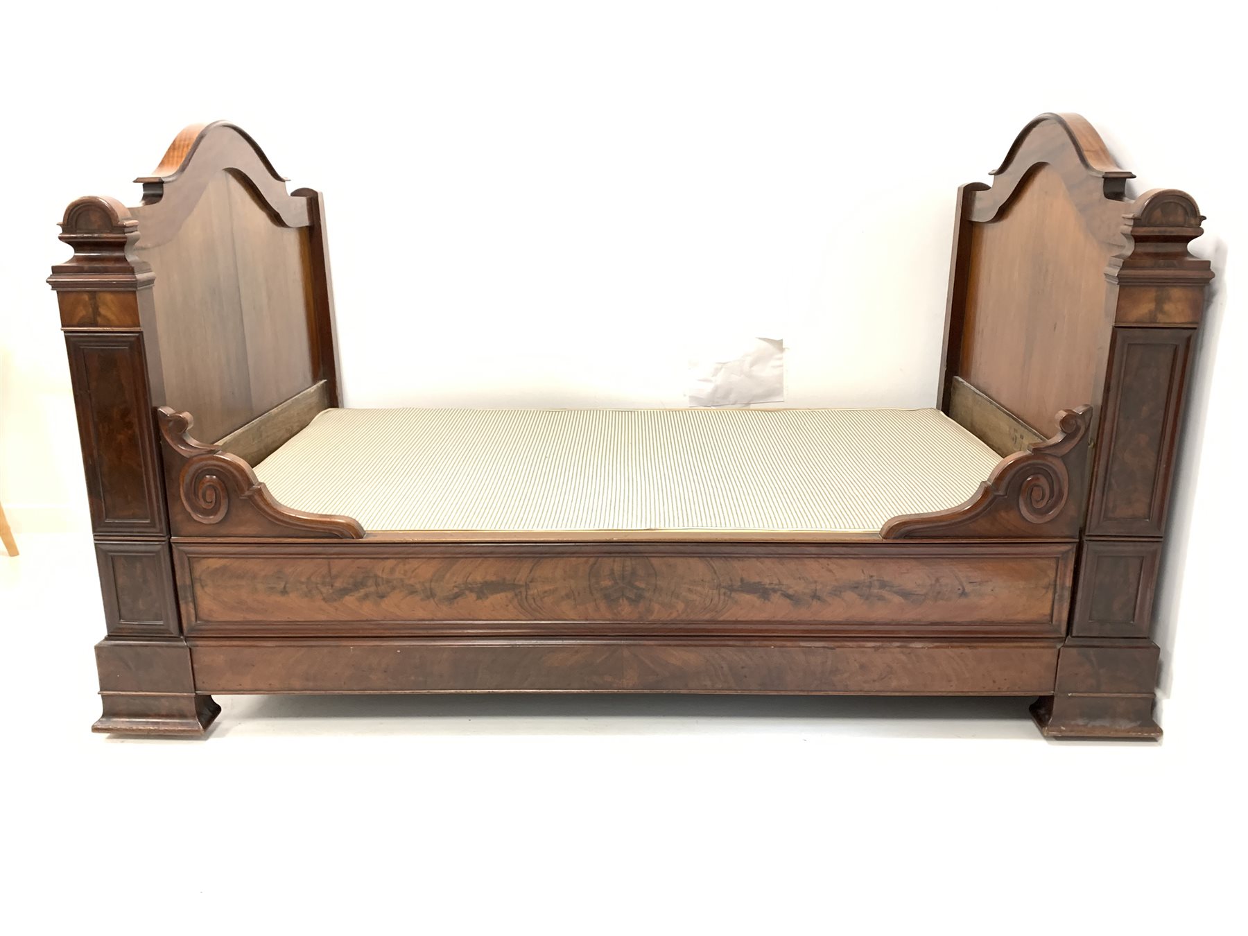 19th century continental figured mahogany single bed, with box base