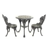 Victorian style heavy painted cast iron garden table, circular top with egg and dart rim over three