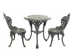 Victorian style heavy painted cast iron garden table, circular top with egg and dart rim over three