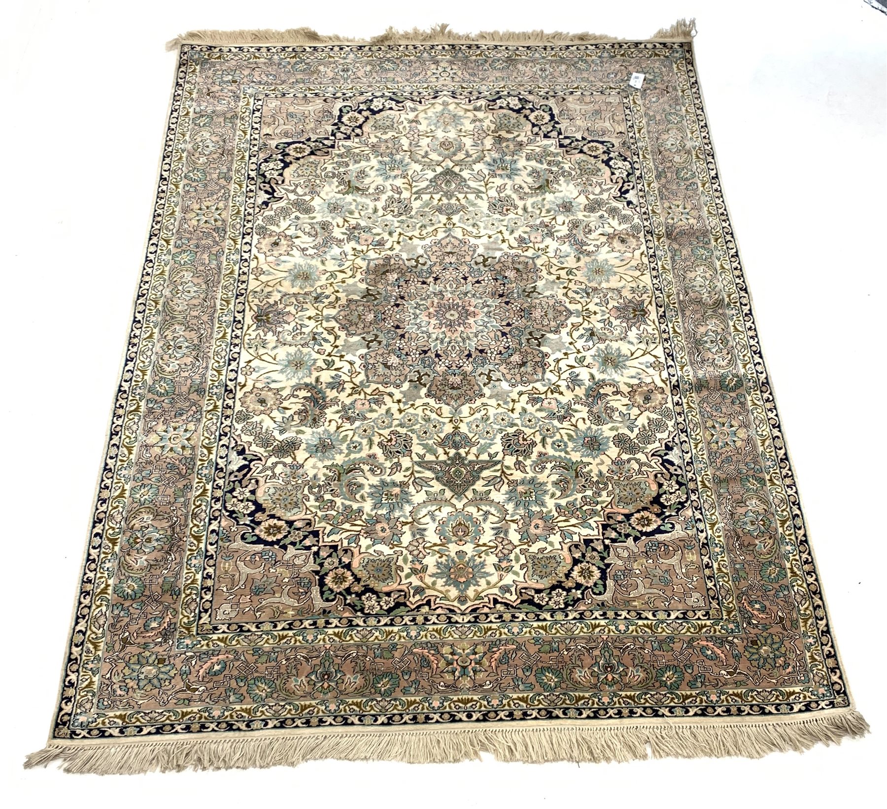 Persian design silk ground rug, central medallion on busy ivory field with blue spandrels, enclosed