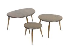 Ercol stained ash nest of three graduating 'pebble' tables