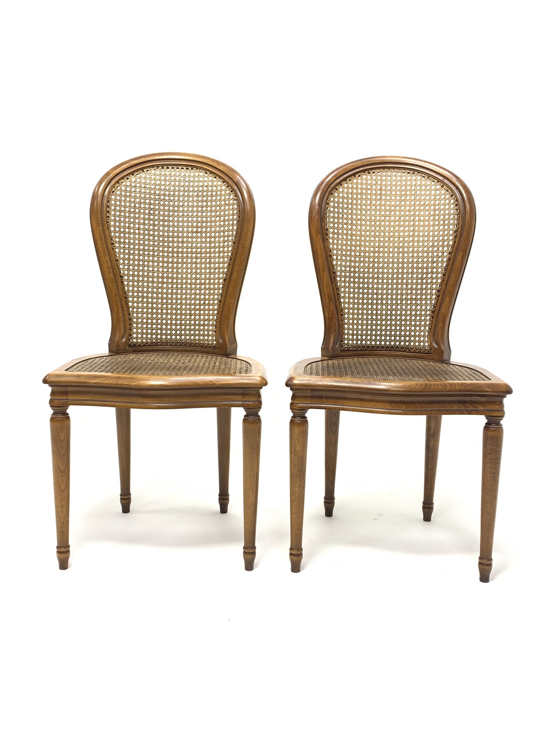 Pair French style berg�re chairs, moulded beech frames, curved cane work backs and serpentine seats,