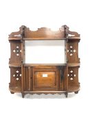 Late Victorian walnut wall hanging shelf and cupboard, with pierced fret cut decoration and single p