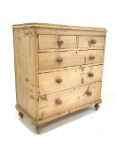 Victorian polished pine chest fitted with two short and three long drawers, raised on turned support