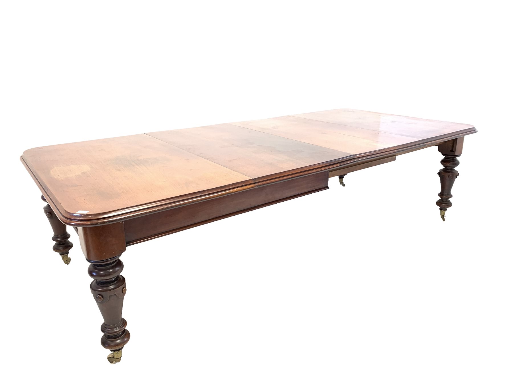 Large Victorian mahogany wind out extending dining table, the rectangular moulded top with rounded c