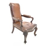 Early to mid 19th century rosewood library open armchair, traditionally upholstered in studded brown