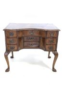 18th century walnut and oak serpentine lowboy, the cross banded, herringbone inlaid and moulded top