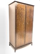 Stag Minstrel mahogany wardrobe, two doors enclosing four shelves, two slides and hanging rail