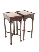 Pair of Edwardian mahogany stands, moulded hinged top over candle slides, scrolled floral carved cor