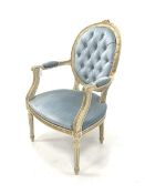 Louis XV style cream and gilt painted open armchair, the buttoned back rest over scrolled arm termin