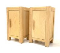 Pair contemporary solid oak lamp cabinets with single door enclosing shelf, raised on stile supports