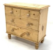 Victorian polished pine chest fitted with two short and two long drawers, raised on turned supports