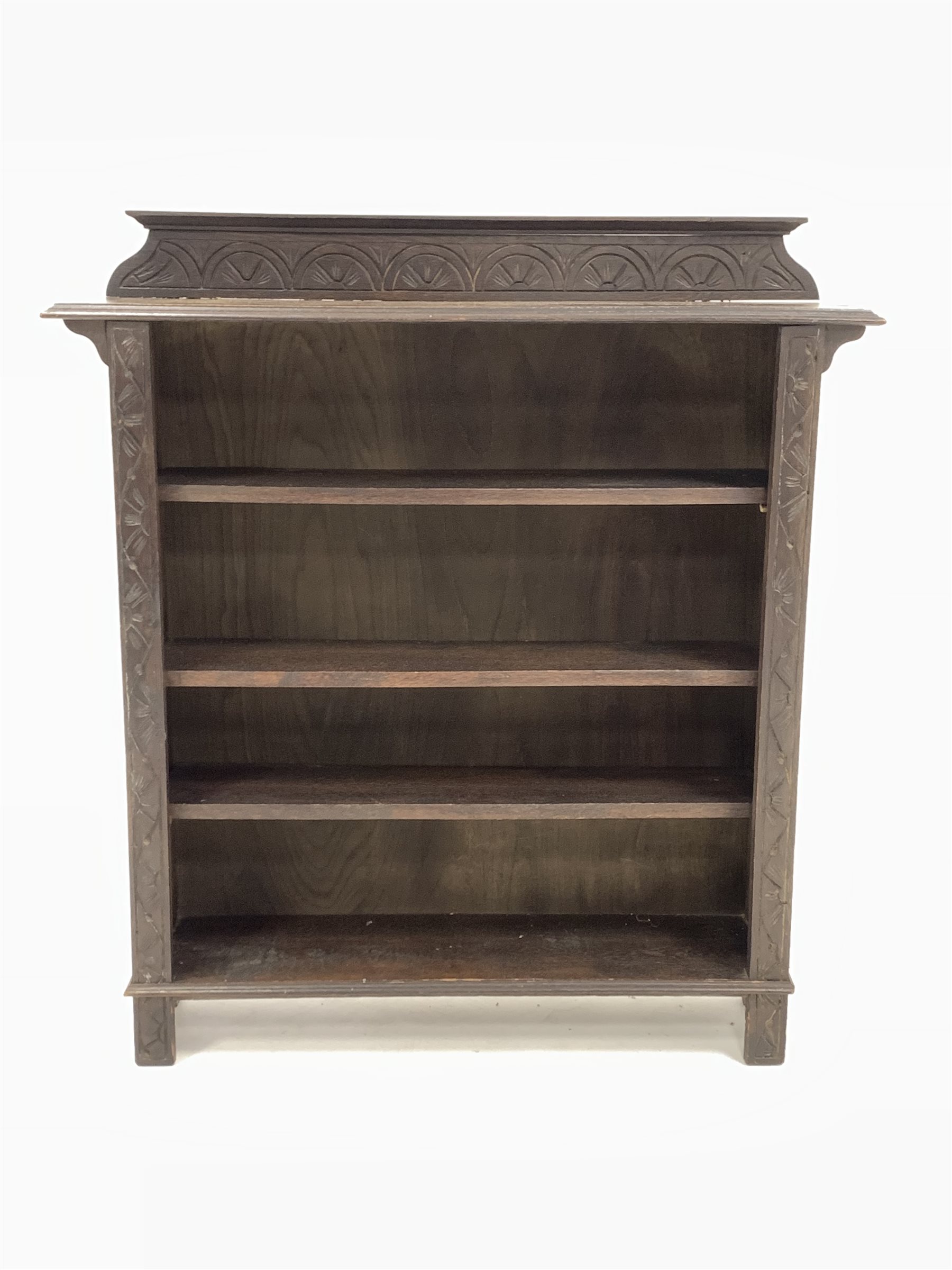 Early 20th century dark oak open bookcase, the raised back with lunette carving over three adjustabl - Image 4 of 6