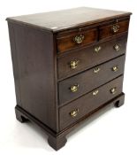 George III mahogany bachelors chest, moulded top over baize lined brushing slide, two short and thr