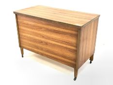 Mid century teak blanket box, with hinged lid raised on square tapered front supports and castors