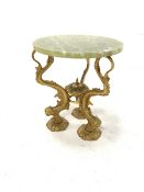 Brass and onyx circular table, cast base in the form of three mythical fish