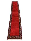 Persian red ground runner, guarded border decorated with floral design