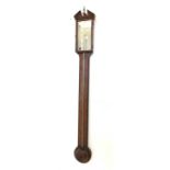 Georgian walnut stick barometer and thermometer, broken pediment with urn finial over quarter sawn v