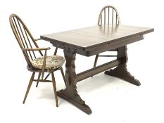 Ercol elm and beech duo draw leaf dining table, rectangular top raised on shaped panel end supports