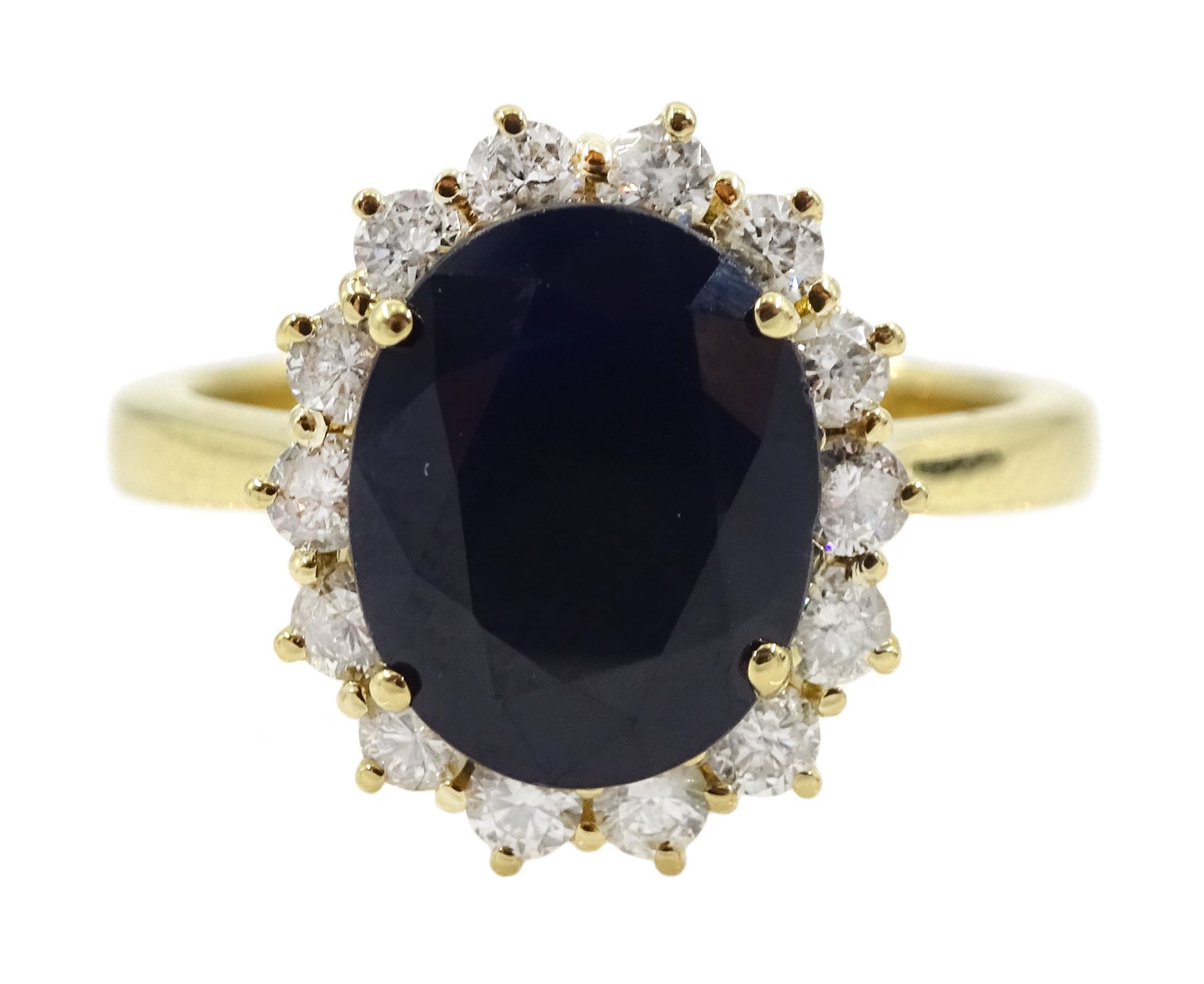 18ct gold oval sapphire and round brilliant cut diamond cluster ring