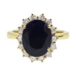 18ct gold oval sapphire and round brilliant cut diamond cluster ring