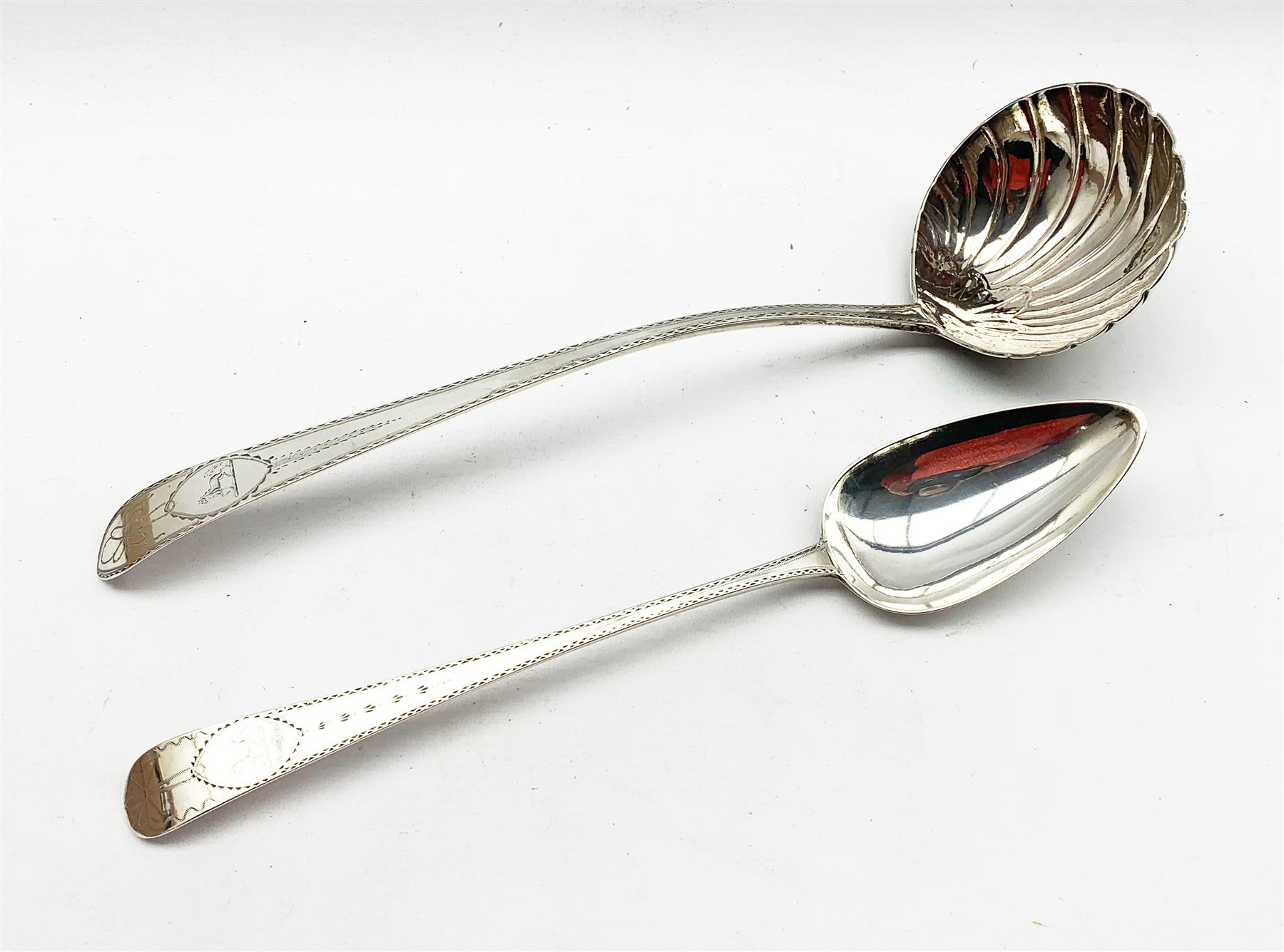 George III Irish silver ladle with bright cut stem and scalloped bowl by James Keating