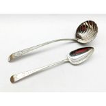 George III Irish silver ladle with bright cut stem and scalloped bowl by James Keating