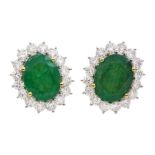 Pair of 18ct gold oval emerald and round brilliant cut diamond cluster stud earrings