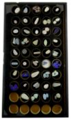 Collection of sixty-six loose opals including black and white opals