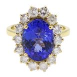 18ct gold oval tanzanite and round brilliant cut diamond cluster ring