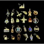 Twenty five 14ct gold charms including bus