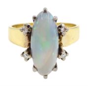Gold opal and four stone round brilliant cut diamond ring