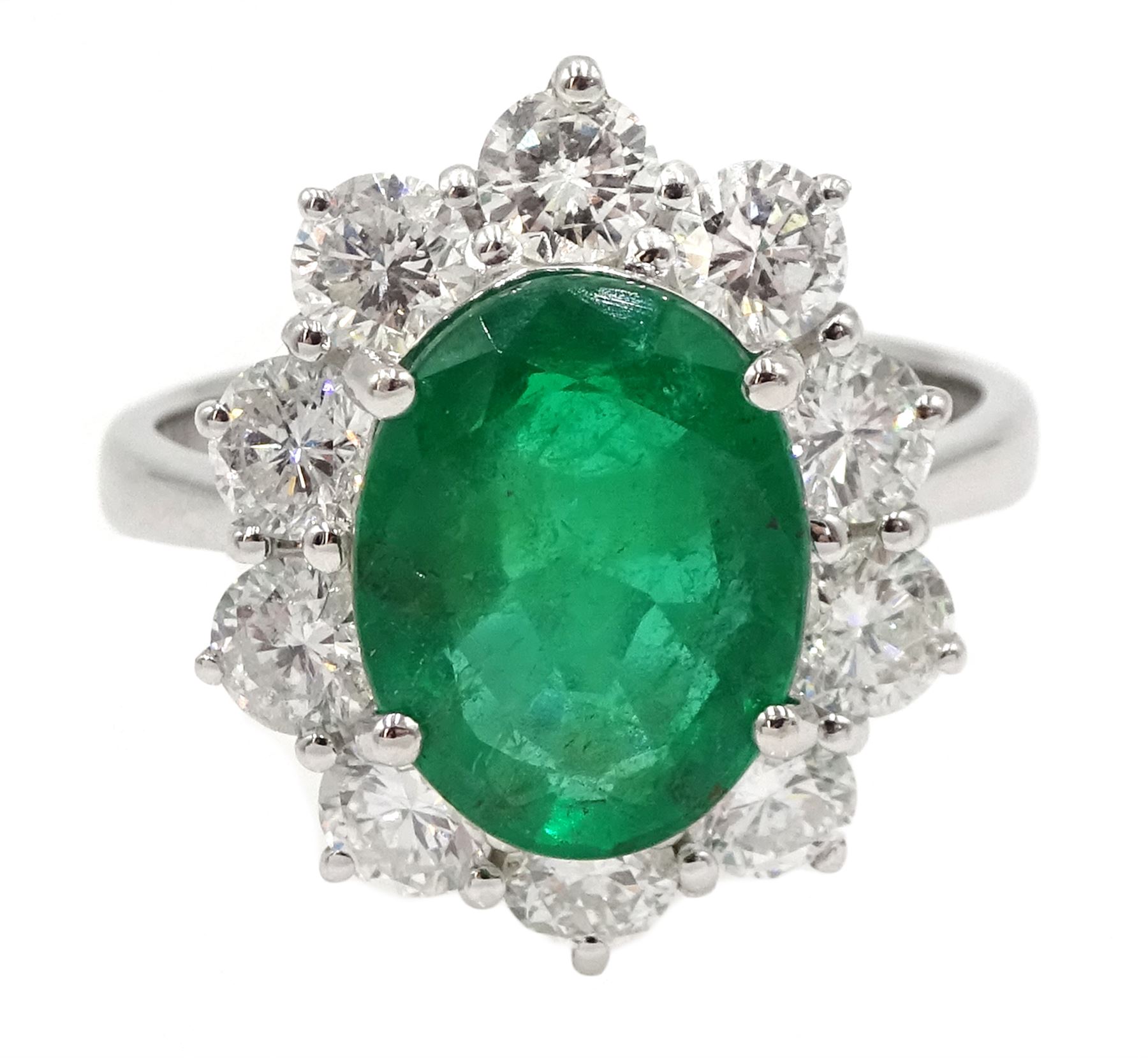 18ct white gold oval emerald and diamond cluster ring