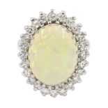 White gold oval opal and diamond cluster ring