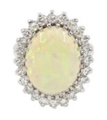 White gold oval opal and diamond cluster ring