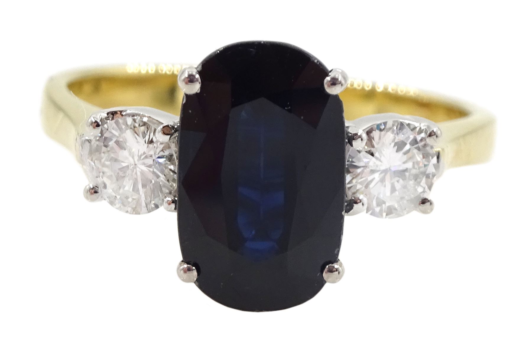 18ct gold three stone oval sapphire and round brilliant cut diamond ring