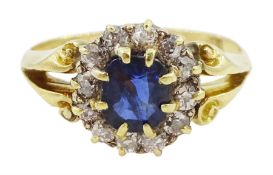 Gold oval sapphire and diamond cluster ring