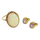 Gold oval opal ring and pair of gold oval opal earrings