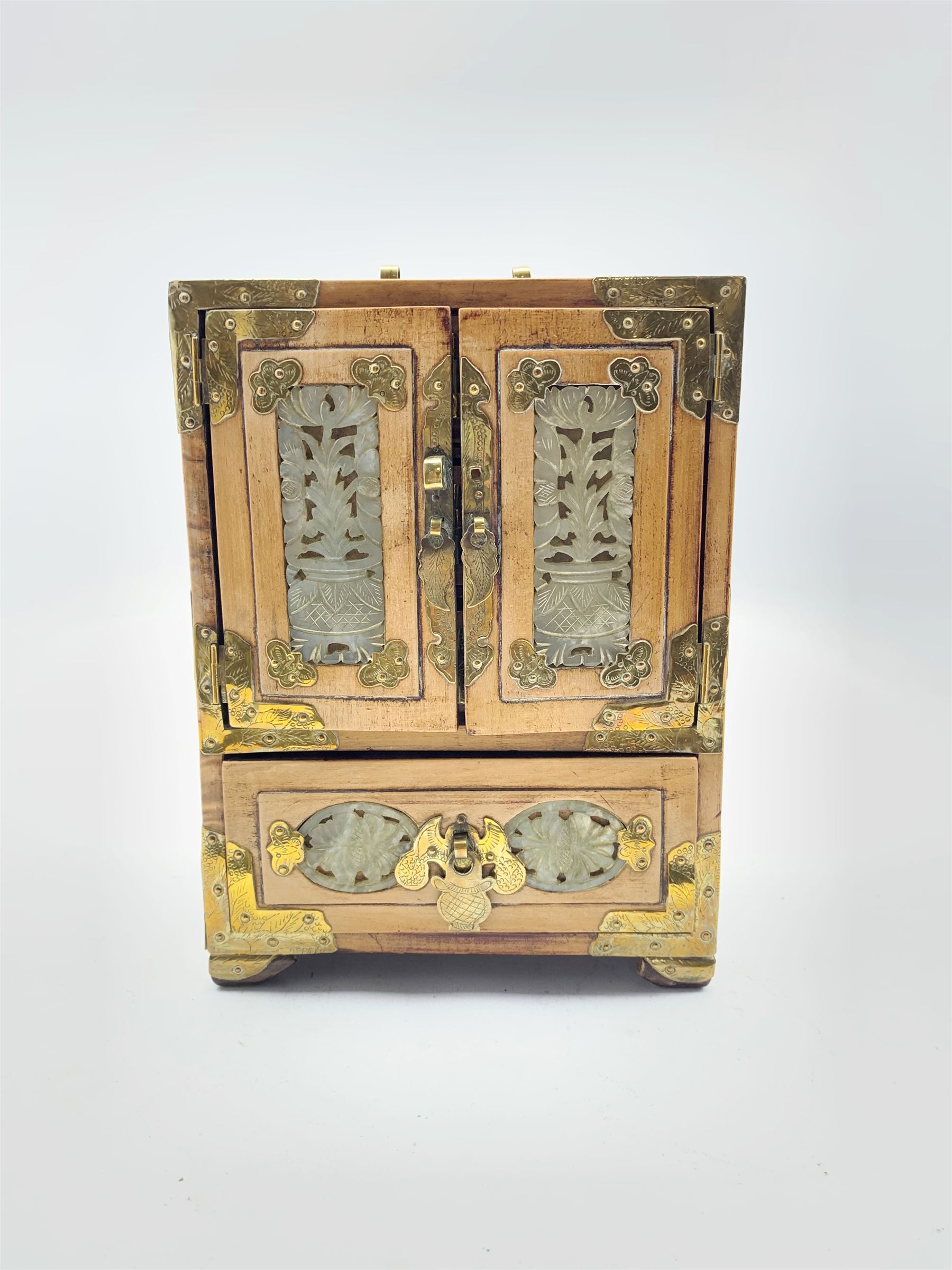 Oriental jewellery chest fitted with small drawers and enclosed by mother of pearl decorated doors a