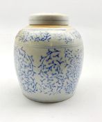 Chinese provincial jar and cover decorated in blue and white with trailing leaves H22cm