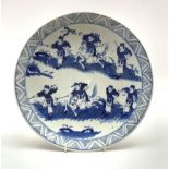 Late 19th/20th Century Chinese charger decorated with huntsmen in blue and white D30cm with characte