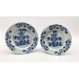 Pair of 18th century Delft tin-glazed plates decorated with a fence and flowers