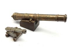 Bronze model of a cannon with tapering barrel on oak trunion L30cm and a steel model cannon L12cm