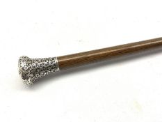 Early 20th century walking cane with embossed silver pommel inscribed J.W. Young RNR
