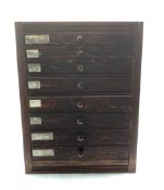 Nest of eight oak and pine shallow drawers W39cm