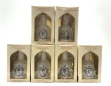 Six Wade Bells royal commemorative whisky decanters